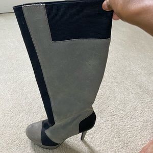 Gray and black riding boots